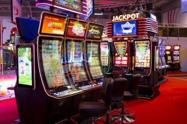 Live dealer managing Texas Poker action with multiple players visible